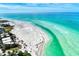Expansive beach scene with vibrant turquoise waters and soft white sand, ideal for beach lovers at 225 Hourglass Way # 101, Sarasota, FL 34242