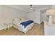 This bedroom features light wood floors, neutral paint, and sliding closet doors for extra storage at 225 Hourglass Way # 101, Sarasota, FL 34242