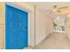 Hallway with updated paint and fixtures leading to the unit at 225 Hourglass Way # 101, Sarasota, FL 34242