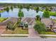 Overhead view of a home backing to a large pond with mature landscaping at 2254 50Th Street E Cir, Palmetto, FL 34221