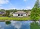 A beautiful backyard overlooks a serene lake, offering picturesque views and a tranquil setting at 2254 50Th Street E Cir, Palmetto, FL 34221