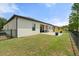 Rear exterior view featuring a manicured lawn, paver patio and views of the community lake at 2254 50Th Street E Cir, Palmetto, FL 34221