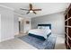 A well-lit bedroom features a blue rug, a blue headboard, and bright white floors at 2254 50Th Street E Cir, Palmetto, FL 34221