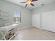 Bedroom has light walls, closets, desk, and a window at 2254 50Th Street E Cir, Palmetto, FL 34221
