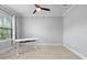 This bedroom features a ceiling fan, window, and a desk at 2254 50Th Street E Cir, Palmetto, FL 34221