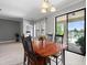 Dining room has tile floors, a chandelier, and sliding glass doors at 2254 50Th Street E Cir, Palmetto, FL 34221