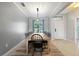 Bright dining room featuring a long table with modern chairs, and an overhead light fixture at 2254 50Th Street E Cir, Palmetto, FL 34221