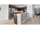 Kitchen boasts stainless appliances, granite countertops and breakfast bar at 2254 50Th Street E Cir, Palmetto, FL 34221