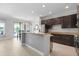 Kitchen featuring stainless steel appliances, breakfast bar, and ample lighting at 2254 50Th Street E Cir, Palmetto, FL 34221