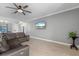The living room features a TV and an open view to the entry and kitchen at 2254 50Th Street E Cir, Palmetto, FL 34221