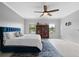 Spacious main bedroom features a large rug, ceiling fan, and lots of natural light at 2254 50Th Street E Cir, Palmetto, FL 34221