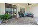 The covered patio includes pavers, comfortable seating, and access from sliding glass doors at 2254 50Th Street E Cir, Palmetto, FL 34221