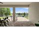 Covered outdoor patio features brick floors, a dining table, and beautiful views of the lake at 2254 50Th Street E Cir, Palmetto, FL 34221