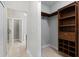 Large walk-in closet with custom shelving and storage space is conveniently located next to the bathroom at 2254 50Th Street E Cir, Palmetto, FL 34221