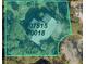Aerial view of a property on a large lot with some trees at 2511 Lords Ln, Sarasota, FL 34231