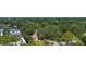 Lush wooded property with meandering creek, charming house, and long driveway at 2511 Lords Ln, Sarasota, FL 34231