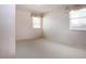 Bedroom with neutral carpet and two windows at 2511 Lords Ln, Sarasota, FL 34231