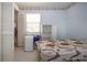 Modest bedroom featuring natural light and a colorful bed frame, providing a cozy ambiance at 2511 Lords Ln, Sarasota, FL 34231