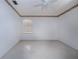 This bedroom features a ceiling fan and a window at 2511 Lords Ln, Sarasota, FL 34231