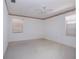 This bedroom features a ceiling fan and two windows at 2511 Lords Ln, Sarasota, FL 34231