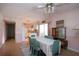 Dining area has aqua chairs, white tablecloth, with access to the kitchen and natural light from a sliding glass door at 2511 Lords Ln, Sarasota, FL 34231