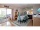 Bright dining room with sliding glass doors, mirrored wall, and table set for six at 2511 Lords Ln, Sarasota, FL 34231