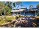 Inviting single-story home with an attached garage and a comfortable front porch at 2511 Lords Ln, Sarasota, FL 34231