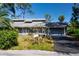 Charming home with a welcoming front yard and a convenient attached two-car garage at 2511 Lords Ln, Sarasota, FL 34231