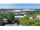 Scenic neighborhood shot with lush greenery and nearby building, showcasing an established community at 2511 Lords Ln, Sarasota, FL 34231