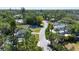 Charming street view with tree-lined street and well-maintained houses creating a neighborhood setting at 2511 Lords Ln, Sarasota, FL 34231