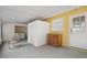 Enclosed outdoor patio area with laundry equipment, furniture, and a small cabinet offering extra storage space at 2751 71St E Dr, Sarasota, FL 34243
