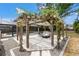 Outdoor patio area with pergola and view of the screened pool at 2778 Greendale Dr, Sarasota, FL 34232
