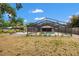 A beautiful backyard pool and spa are protected by a screened enclosure, complemented by an outdoor patio area with pergola at 2778 Greendale Dr, Sarasota, FL 34232