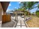 Outdoor patio area with pergola and view of the screened pool at 2778 Greendale Dr, Sarasota, FL 34232