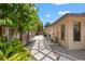 Side view of home with lush landscaping and stone path at 2778 Greendale Dr, Sarasota, FL 34232