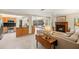 Open concept living space with view of the fireplace and stainless steel appliances at 2778 Greendale Dr, Sarasota, FL 34232