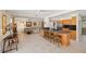 Open-concept kitchen flows into a sun-drenched living area with a breakfast bar and comfortable seating at 2778 Greendale Dr, Sarasota, FL 34232