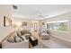 Relaxing living room with neutral decor, a large window, and comfortable seating at 2778 Greendale Dr, Sarasota, FL 34232
