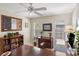Office space featuring a large desk, natural light, and ample storage at 2778 Greendale Dr, Sarasota, FL 34232