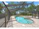 Enclosed in-ground pool and spa, with brick-paved surround, perfect for outdoor relaxation and entertainment at 2778 Greendale Dr, Sarasota, FL 34232