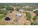 Aerial view featuring a pond and outbuilding at 28706 102Nd E Dr, Myakka City, FL 34251