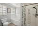 Bathroom featuring separate shower, bathtub, toilet, and windows at 28706 102Nd E Dr, Myakka City, FL 34251