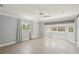 Bright bedroom featuring tile floors, a ceiling fan, and natural light from several windows at 28706 102Nd E Dr, Myakka City, FL 34251