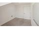 This bedroom features neutral carpet, light walls and trim, and a single door at 28706 102Nd E Dr, Myakka City, FL 34251