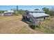 Unique home featuring an elevated wooden deck, offering a rustic charm and scenic views at 28706 102Nd E Dr, Myakka City, FL 34251