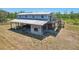 Unique exterior view showing the structure and deck at 28706 102Nd E Dr, Myakka City, FL 34251