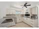 Updated kitchen boasting granite countertops, stainless steel appliances, and sleek white cabinetry at 28706 102Nd E Dr, Myakka City, FL 34251