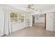 Open concept living space with a window overlooking a yard at 28706 102Nd E Dr, Myakka City, FL 34251