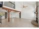 Bright living room with a fireplace, tiled floor, spiral staircase and high ceiling at 28706 102Nd E Dr, Myakka City, FL 34251