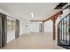 Open living room with tiled floors, natural light and a spiral staircase at 28706 102Nd E Dr, Myakka City, FL 34251